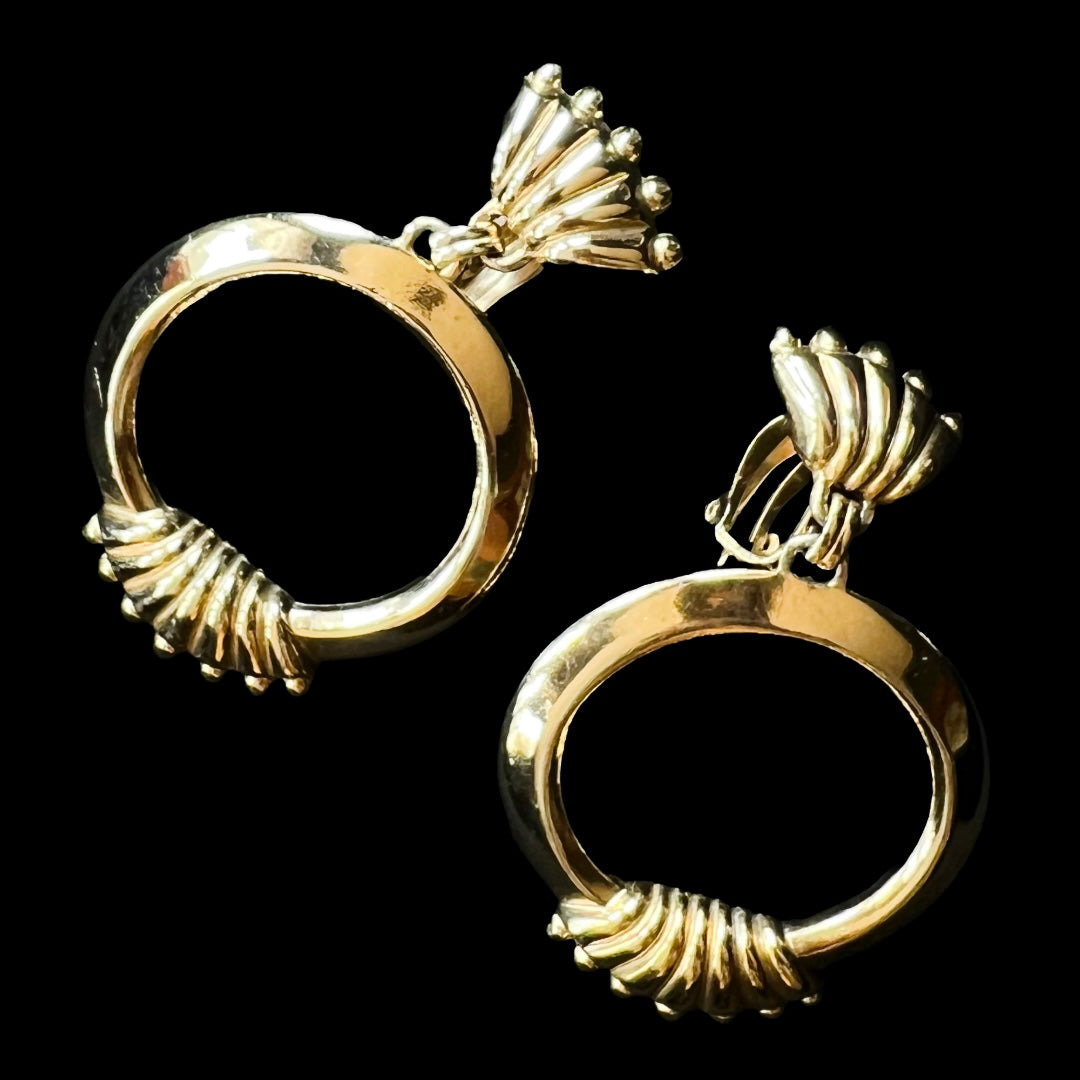 Rare gold vintage winged Schiaparelli hoop clip on earrings.