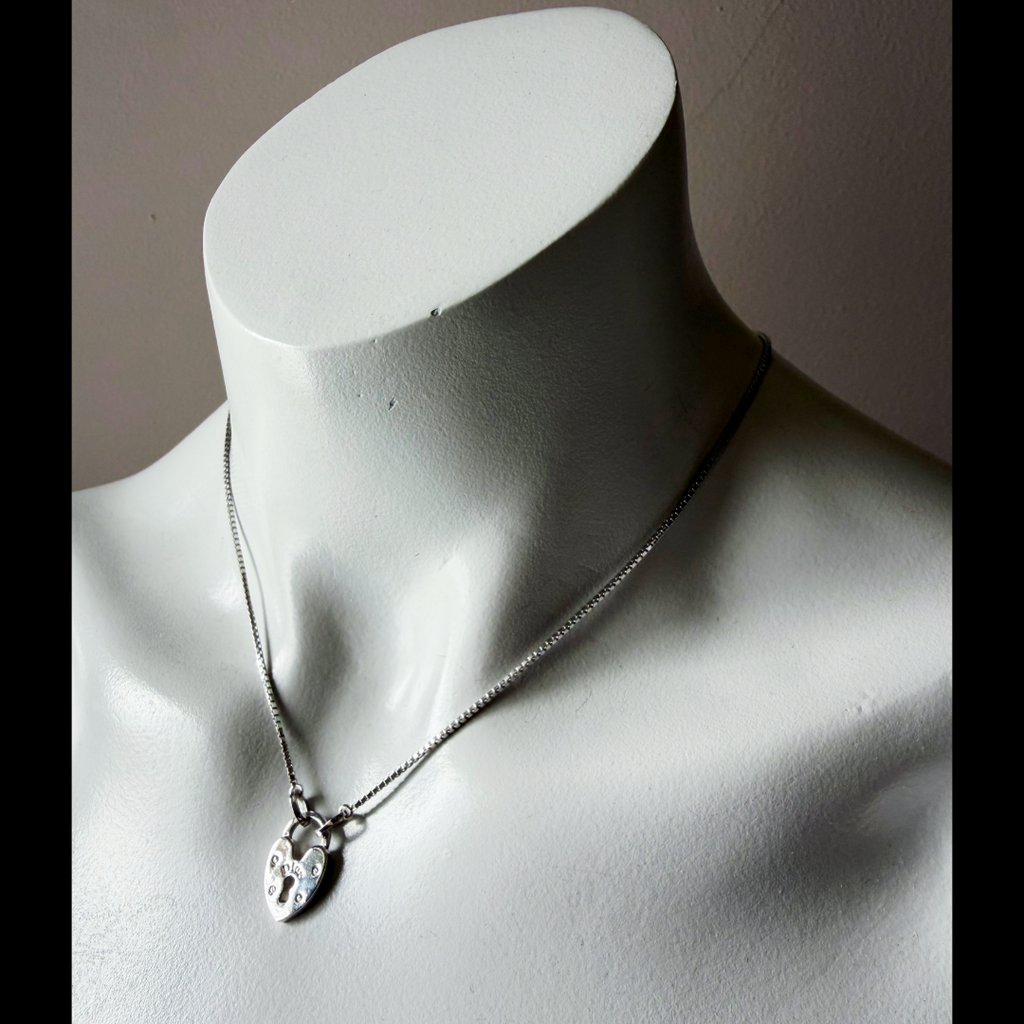 Christian Dior Silver Heart Lock Charm Necklace — vintage 2000s Christian Dior jewellery in silver