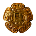 Gold emblem medallion brooch with intricate designs and vintage Fendi branding 
