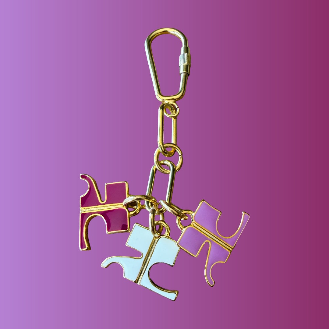 Courrèges 1990s Gold and Pink Enamel Logo Charm Keychain — vintage 1990s Courrèges accessory in gold, pink, purple, white