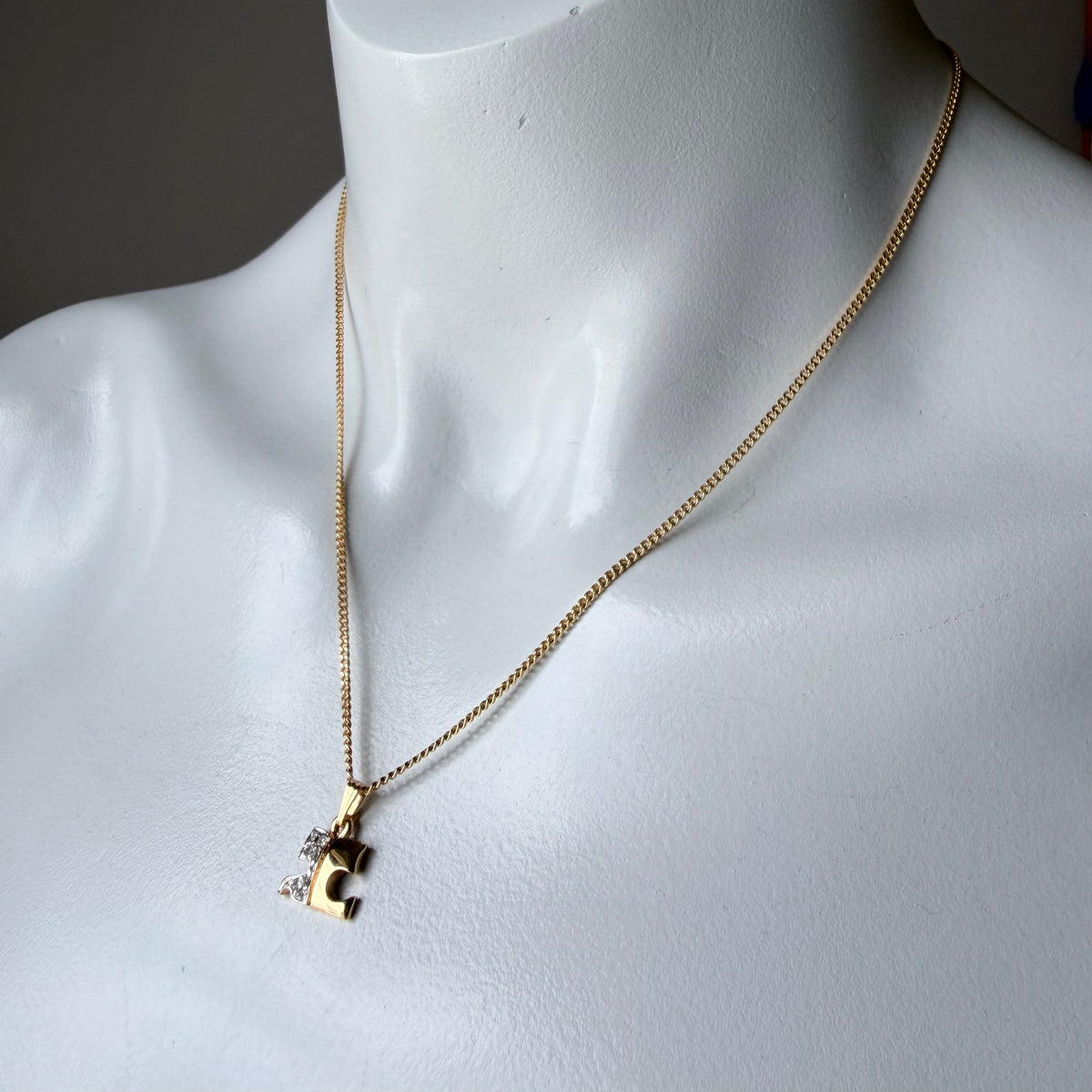 1990s Courrèges Gold and Silver Tone Rhinestone Puzzle Piece Pendant Necklace — vintage 1990s Courrèges jewellery in gold, silver