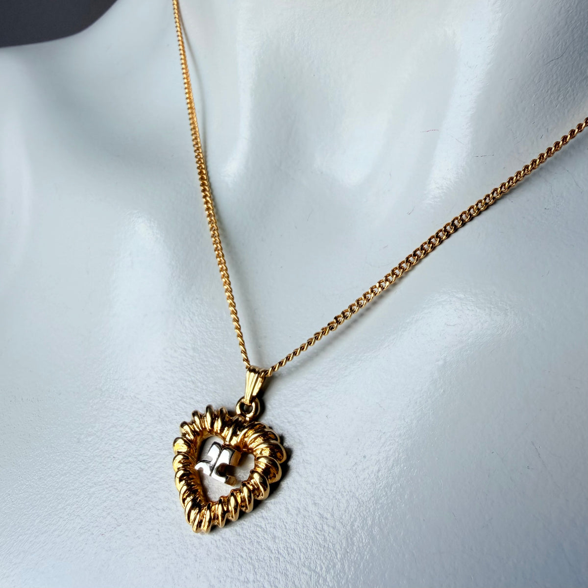 Courrèges Gold Tone Heart Logo Pendant Necklace — vintage 1990s Courrèges jewellery in gold, silver
