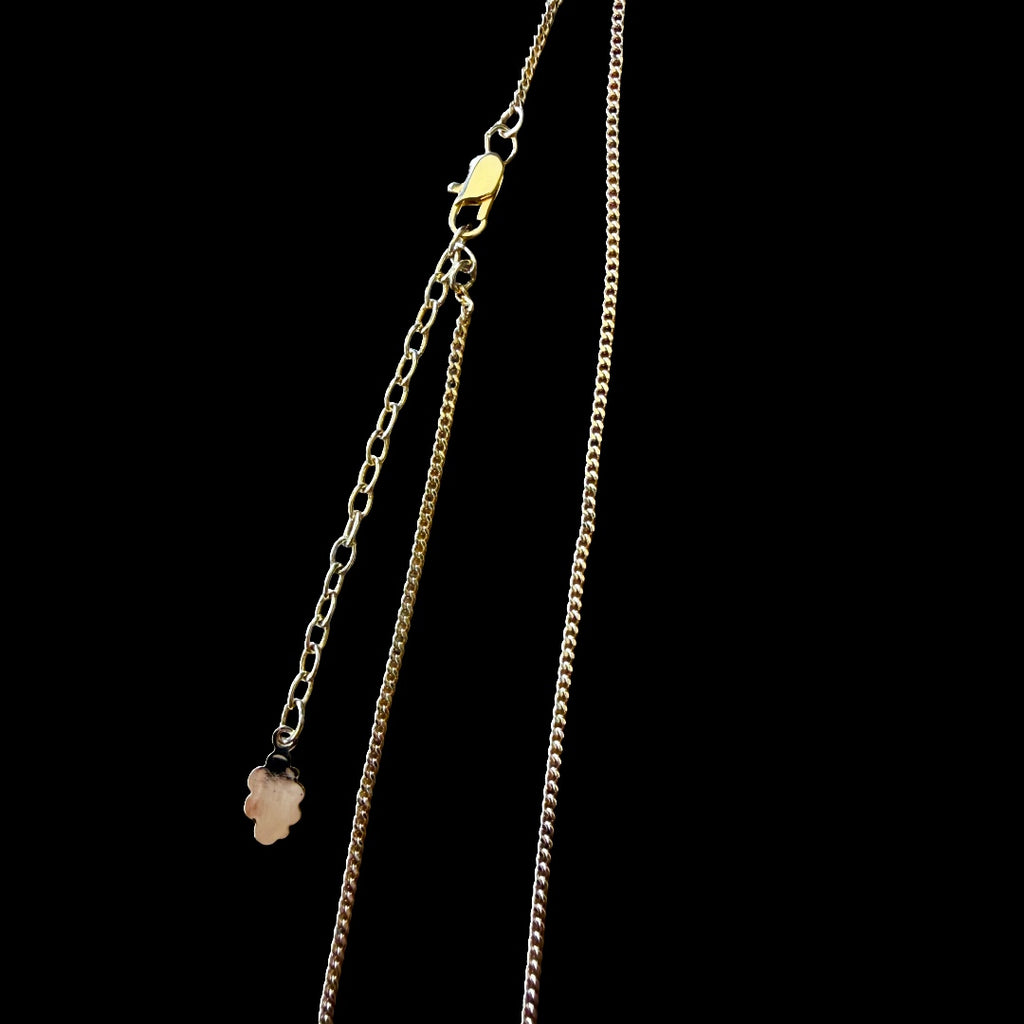 1990s Courrèges Gold and Silver Tone Rhinestone Puzzle Piece Pendant Necklace — vintage 1990s Courrèges jewellery in gold, silver