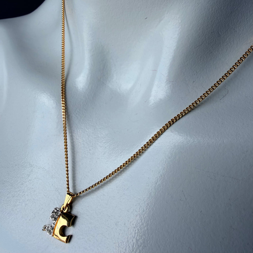 1990s Courrèges Gold and Silver Tone Rhinestone Puzzle Piece Pendant Necklace — vintage 1990s Courrèges jewellery in gold, silver