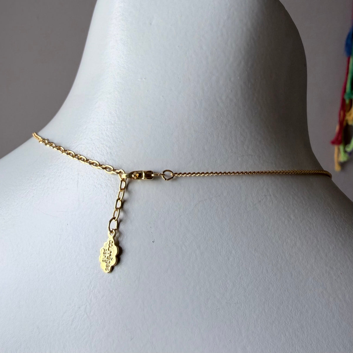 1990s Courrèges Gold and Silver Tone Rhinestone Puzzle Piece Pendant Necklace — vintage 1990s Courrèges jewellery in gold, silver