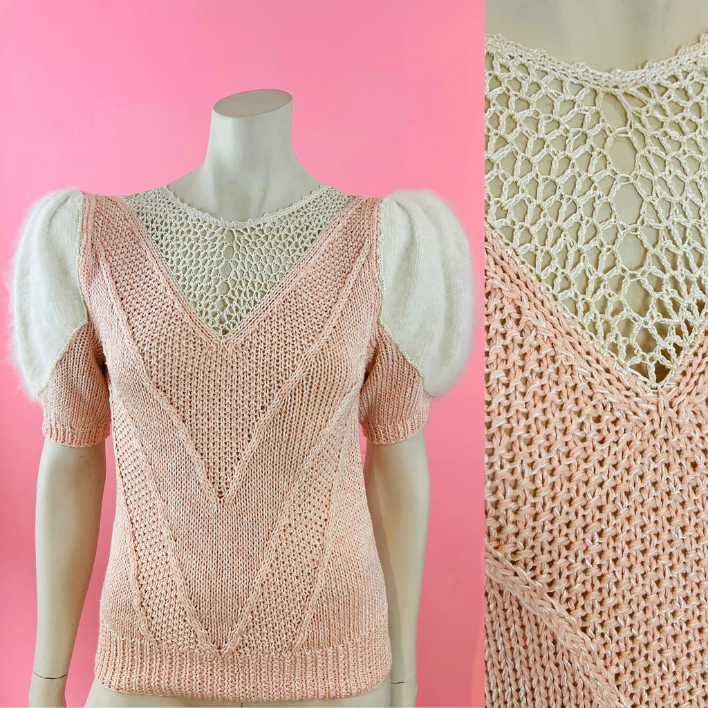 Nannell label pink sweater with open knit details and angora puff sleeves.