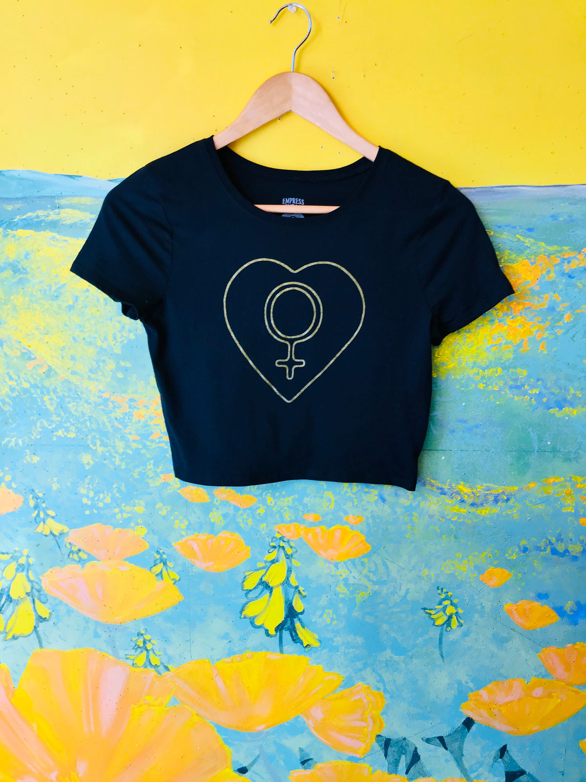Handmade in Berkeley, CA, this black crop top with gold screen printing is a must for your wardrobe!  Come visit us at the vintage shop on Alcatraz Ave.