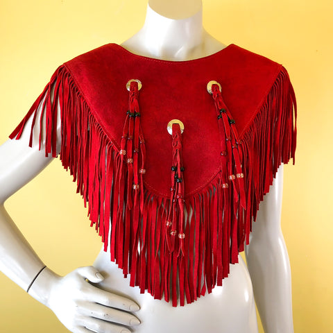 Red suede leather poncho fringe capelet with concho details!  Find more vintage clothing treasure at our shop in Berkeley, California!