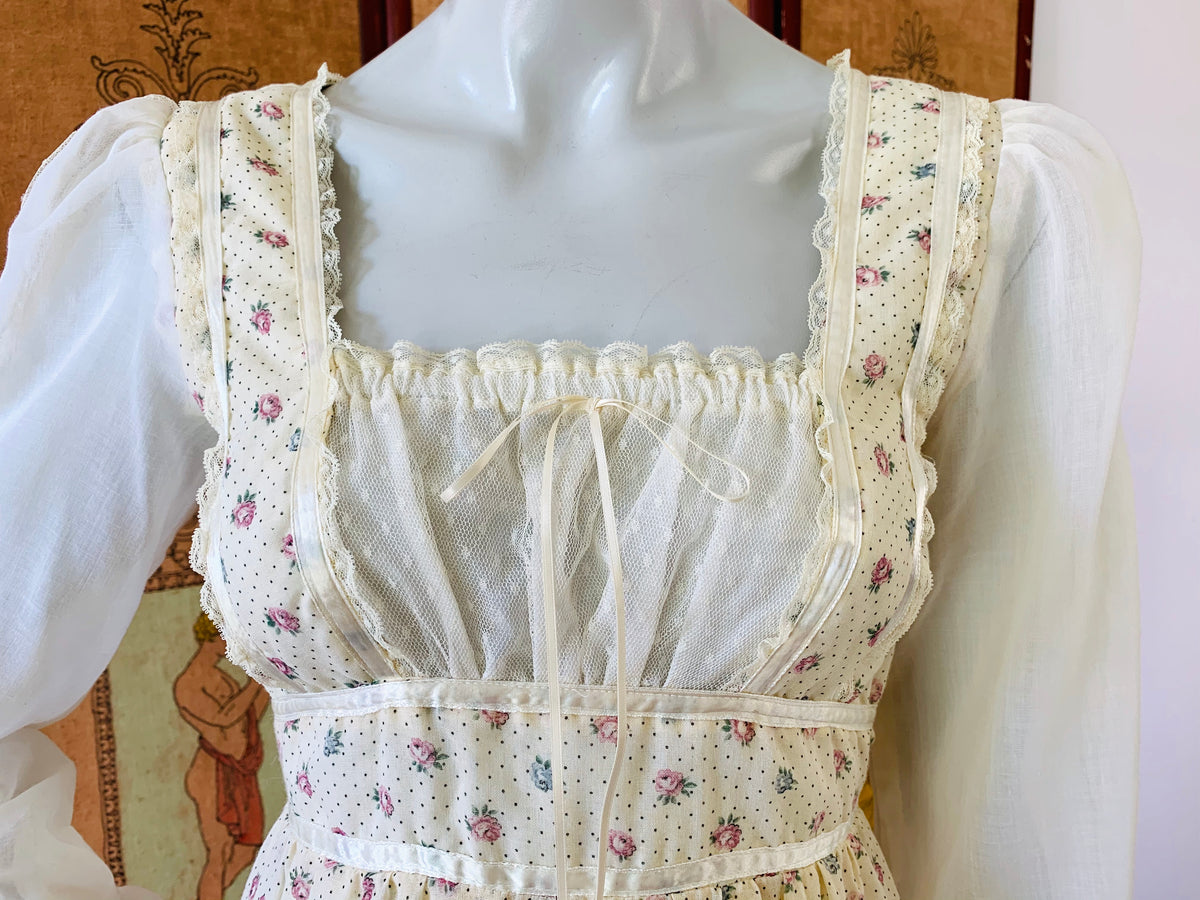 This Gunne Sax dress has everything, a lace bodice and poet sleeves with lace panels.  The boho hippie maxi dress from the 1970s available from Empress Vintage!