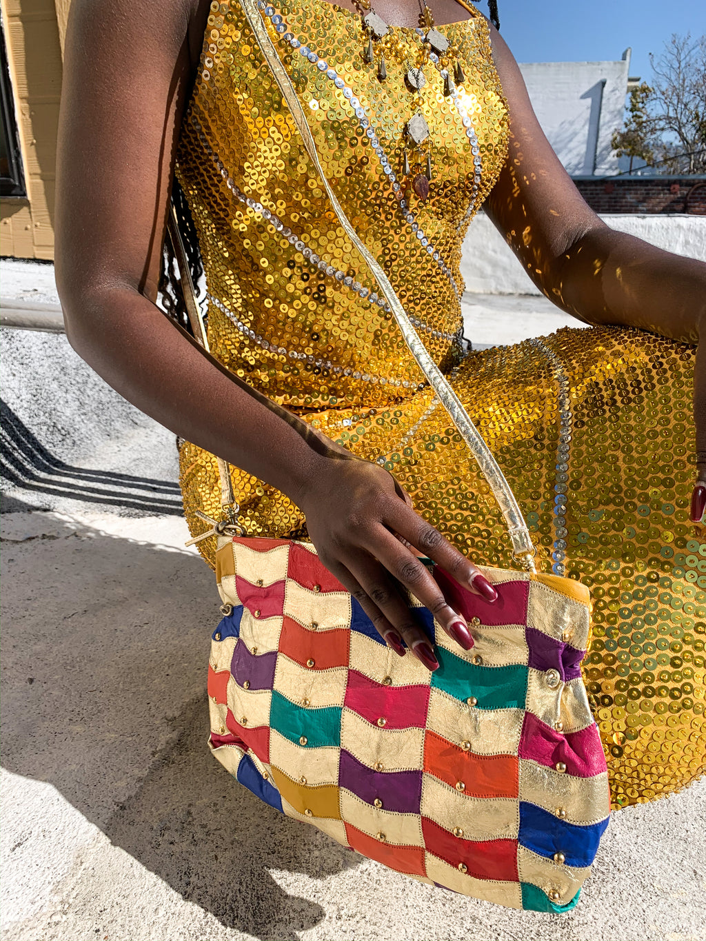 Rainbow gold studded leather vintage purse is available now on the website!  Visit us in California.
