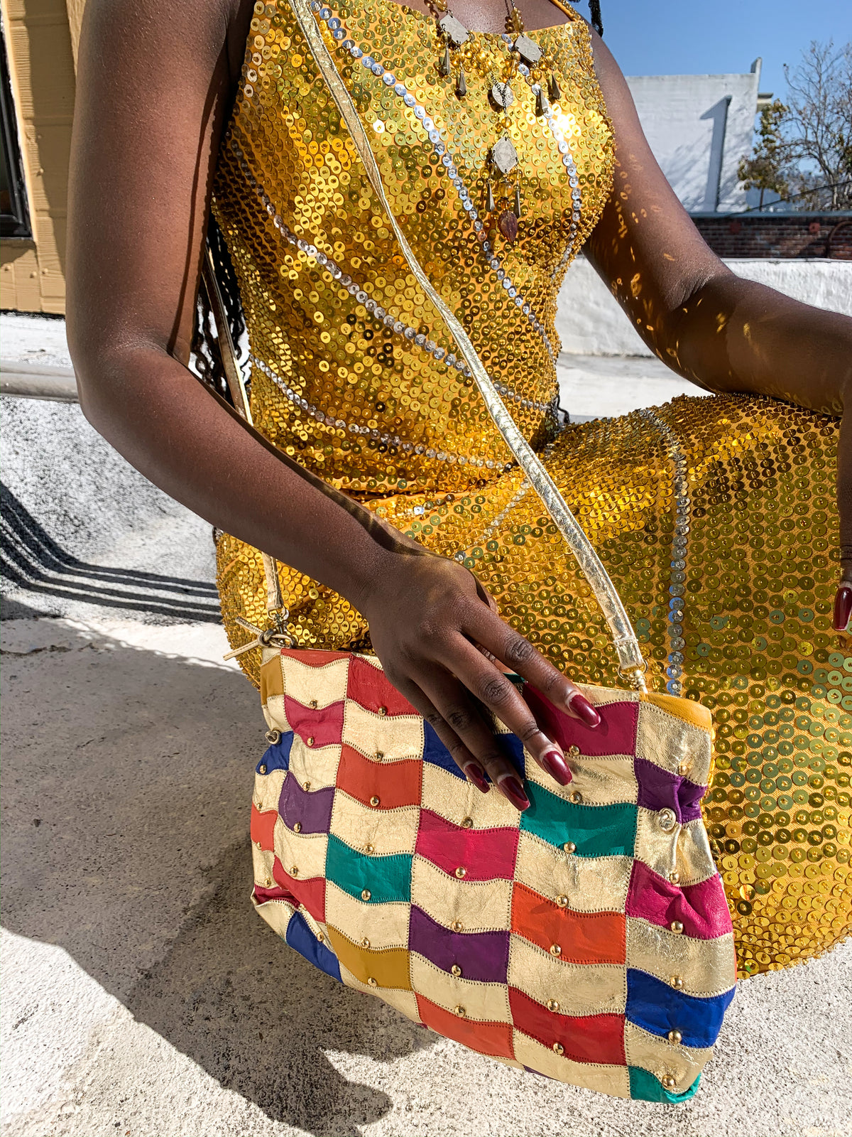 Rainbow gold studded leather vintage purse is available now on the website!  Visit us in California.