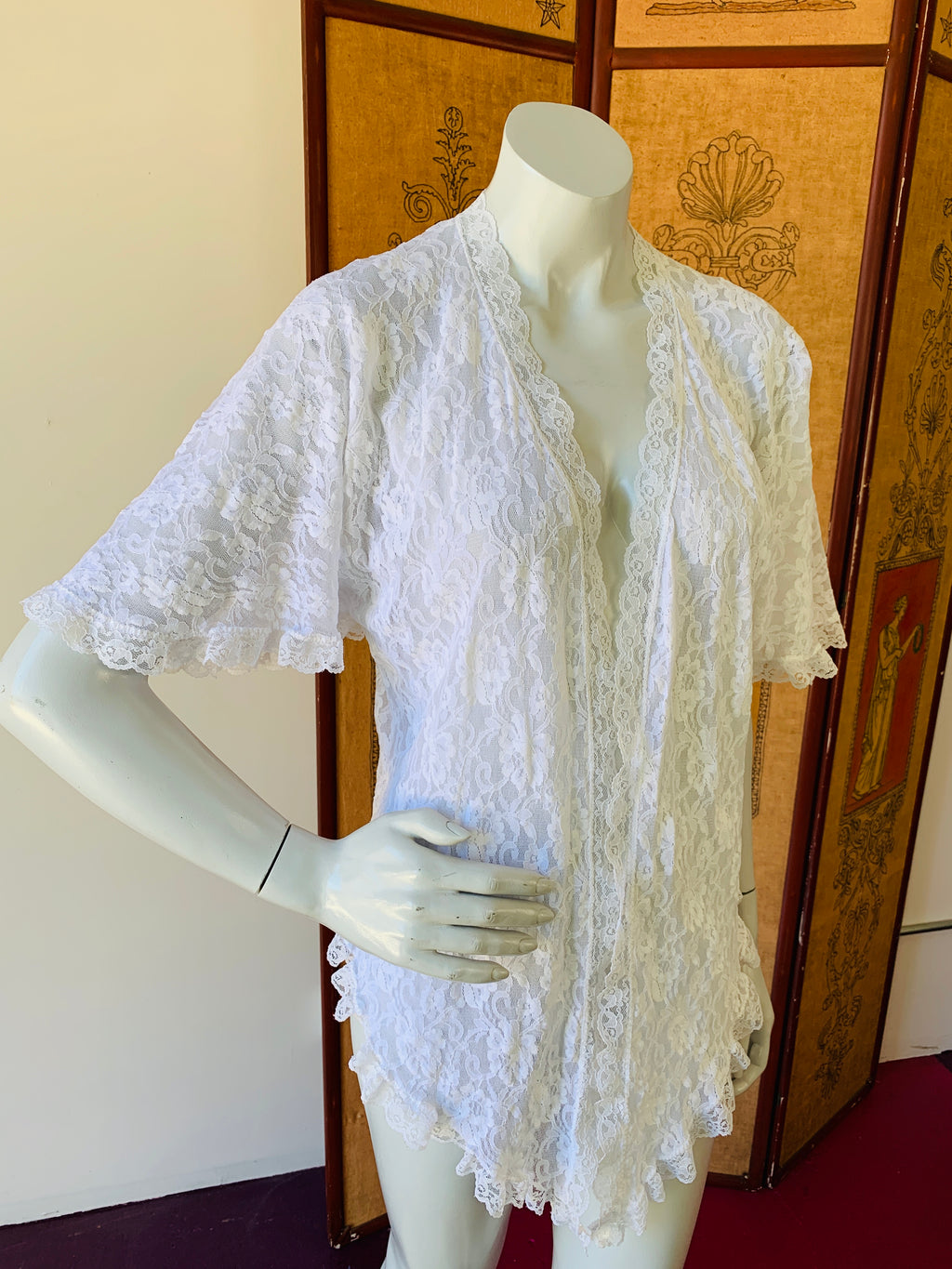 White lace vintage lingerie jacket available at Empress Vintage.  Shop our site for the latest vintage clothing arrivals.