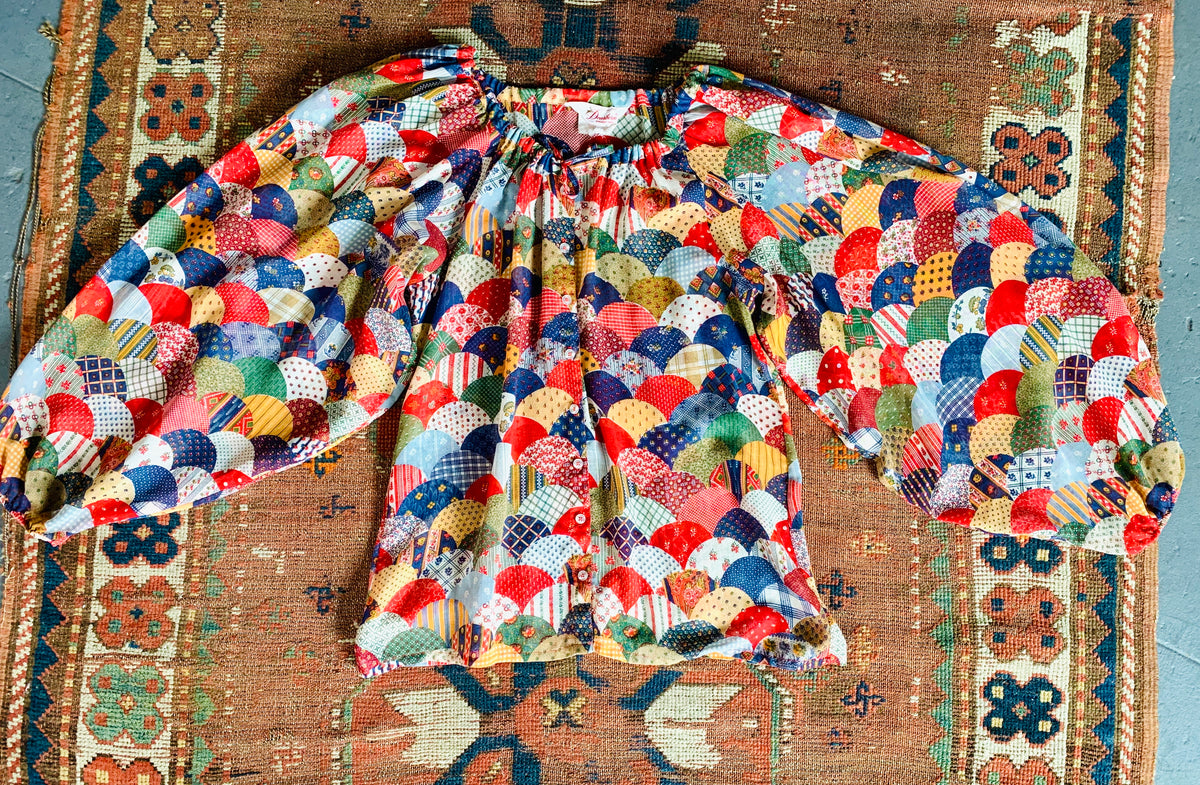 Balloon sleeve patchwork print 1970s blouse. The best vintage clothing in the Bay Area is at Empress Vintage!  Don't miss out on these amazing 70s pieces.